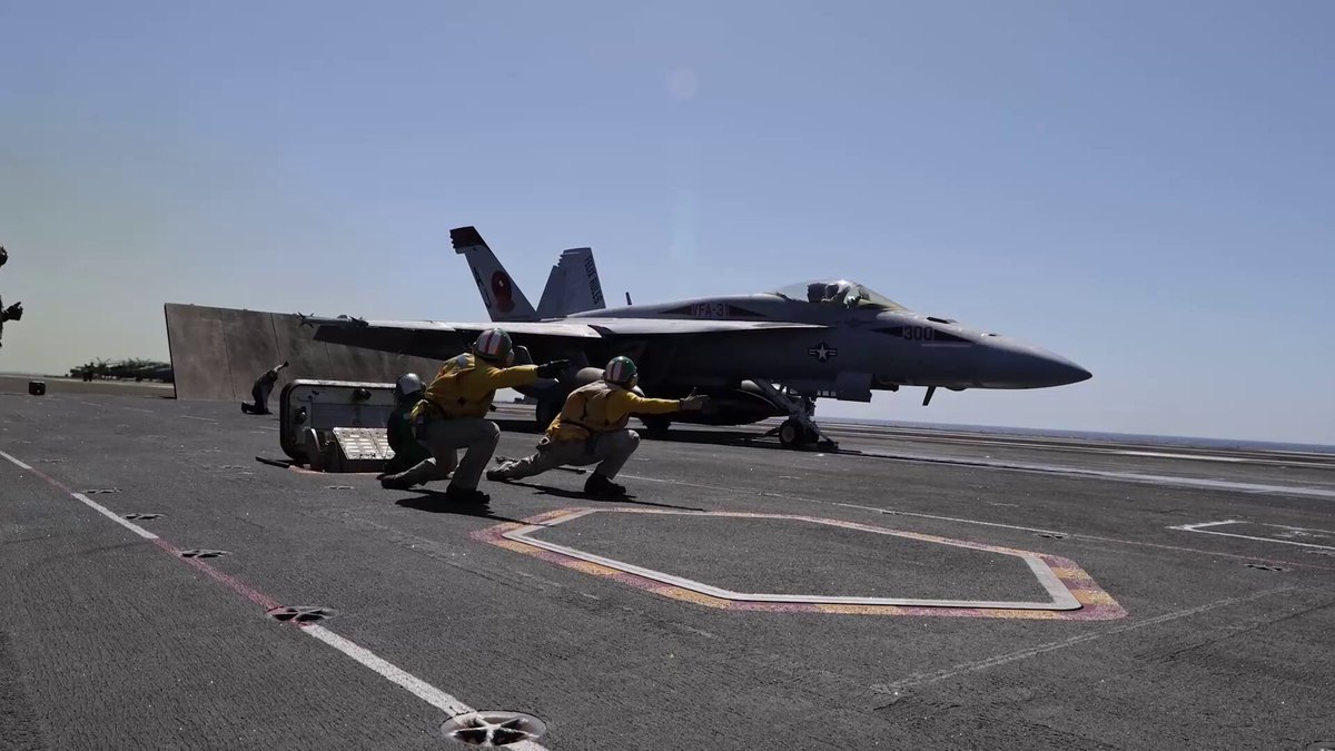 F/A-18E Super Hornet launching from the USS Gerald R. Ford (CVN 78) on an Iran strike mission, flying over 800 miles from the northern Red Sea.