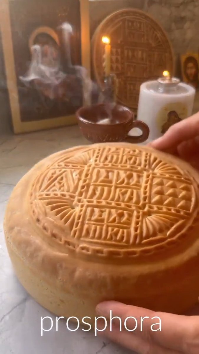 A traditional prosphora loaf, stamped before baking and used in the preparation of the Eucharist in Orthodox liturgy.