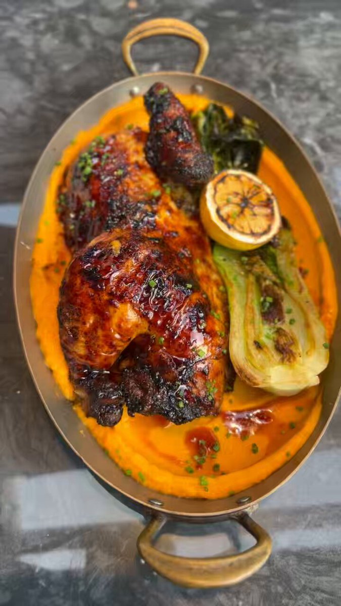 Black Garlic Chicken: Black garlic chili glaze, butternut squash puree, charred bok choy and lemon