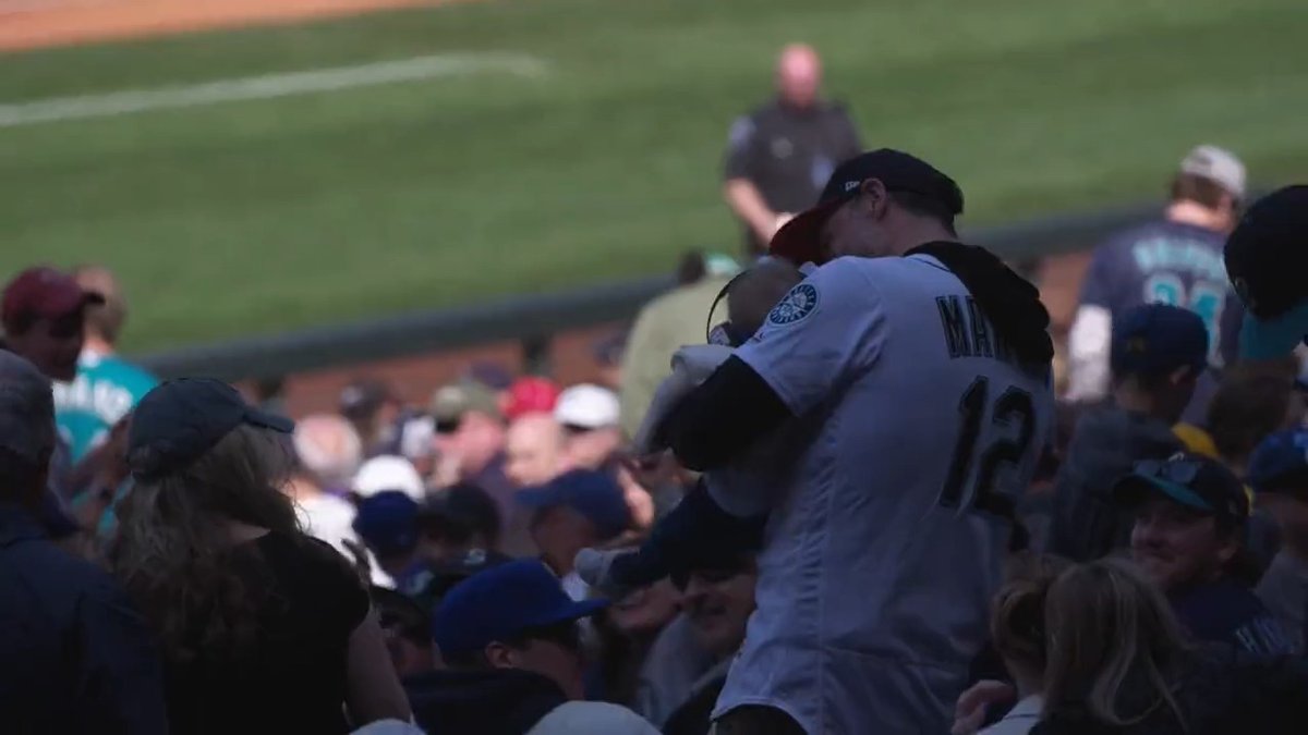 Don't think a dad holding a kid has ever dropped a baseball