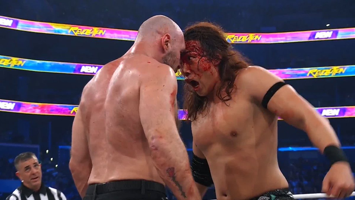 Konosuke Takeshita floors the champ with a thunderous lariat! Watch #AEWRevolution LIVE on PPV!