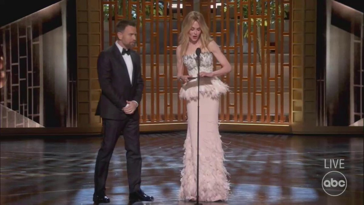 Teyana Taylor playfully puts Paul Thomas Anderson in a headlock as #OneBattleAfterAnother wins Best Picture at the #Oscars (via ABC/AMPAS)