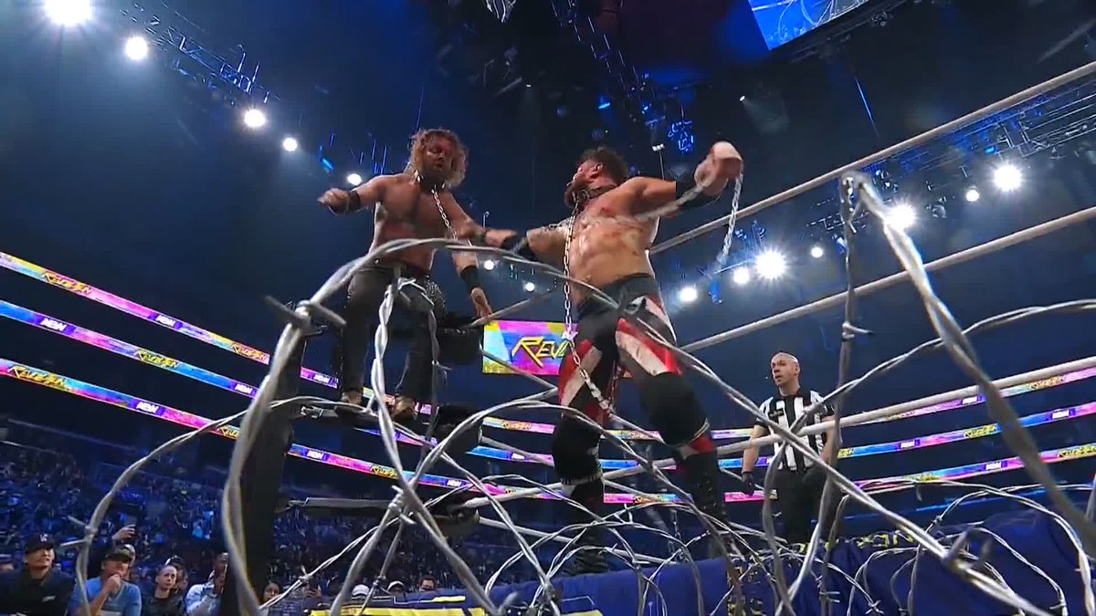 Hangman gets sent through the barbed wire board! Watch #AEWRevolution LIVE on PPV!