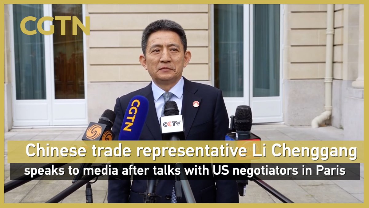 Chinese trade representative Li Chenggang speaks to media after talks with US negotiators in Paris