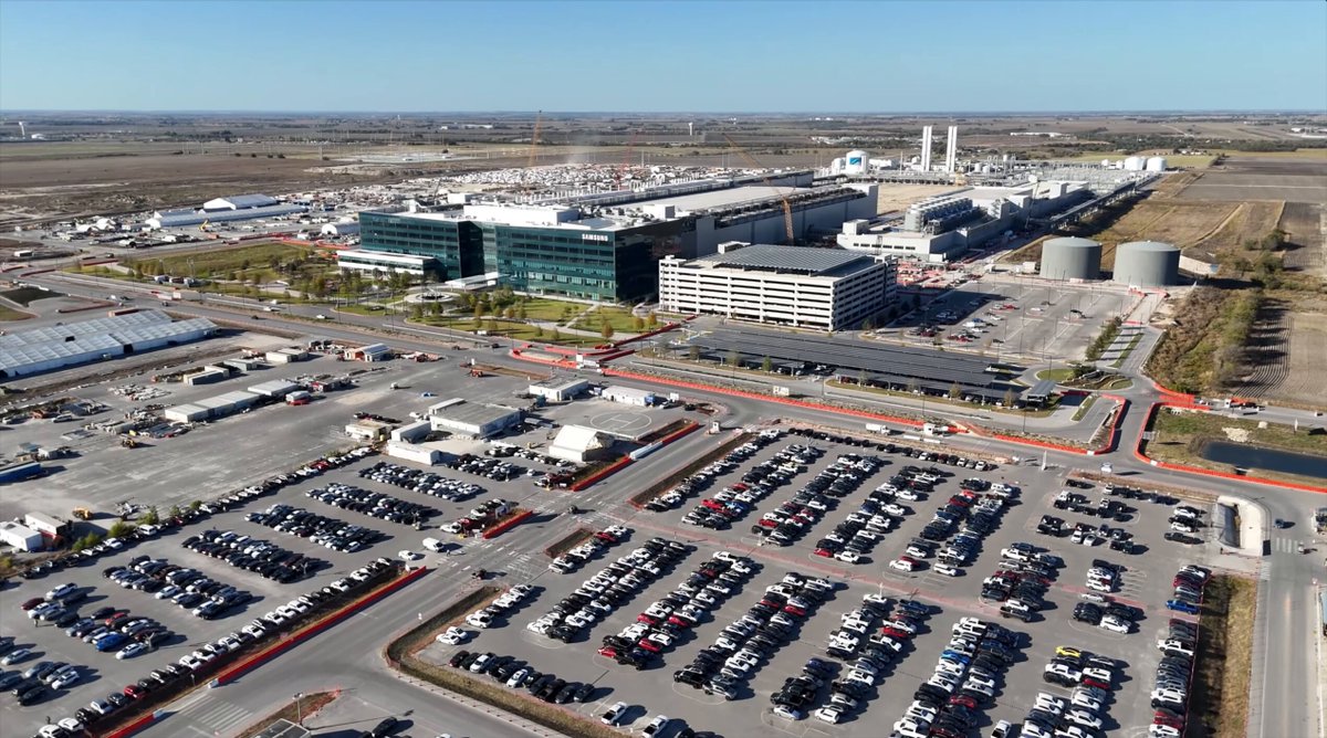 NEWS: Samsung is preparing to build a second chip factory at its semiconductor cluster in Taylor, Texas. The first fab (below) is Samsung's new $25 billion chip fabrication facility that will help produce Tesla's future AI6 (HW6) chip. Samsung wants to expand and build a second chip fab as major U.S. tech companies line up to place their orders amid strained capacity at Taiwanese rival TSMC. The facility is a 40 minute drive from Tesla's Giga Texas factory. Last year, Tesla signed a $16.5 billion deal with Samsung to produce these AI6 chips, but Elon Musk says that number is "just the bare minimum. Actual output is likely to be several times higher." Various Tesla products such as their cars and their Optimus robot will use this AI6 chip. The first Samsung fab facility in Taylor is expected to be operational in 2026. (drone footage is from Nov 2025 via Airwave Dynamics)