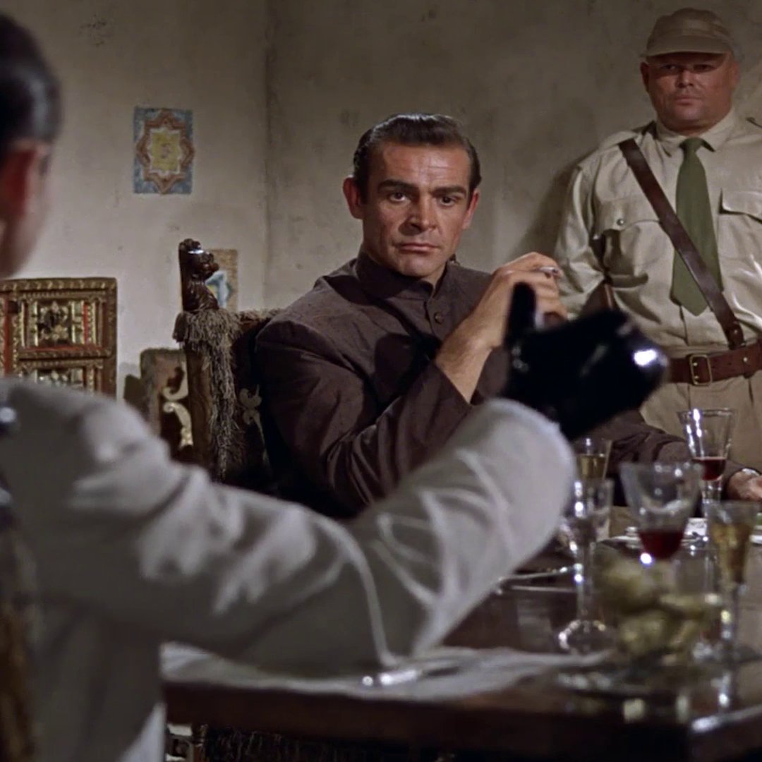 Only a subtle threat… Dr. No (Joseph Wiseman) demonstrates his deadly strength to Bond (Sean Connery) in DR. NO.