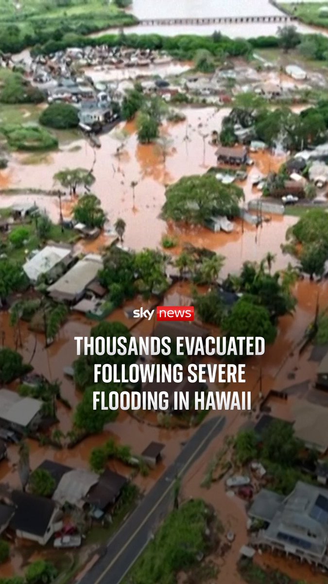 Streets and cars have been swallowed up by floodwater across towns north of Honolulu, as thousands have been told to evacuate by officials