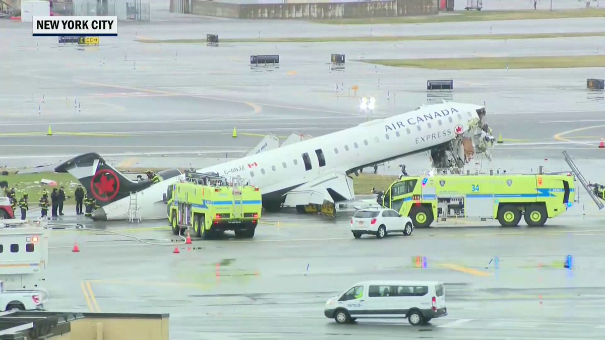 Two pilots died and dozens were injured, including a flight attendant found alive on the tarmac still strapped to her seat, after an Air Canada Express plane collided with a fire-and-rescue vehicle at New York’s LaGuardia Airport late Sunday night.