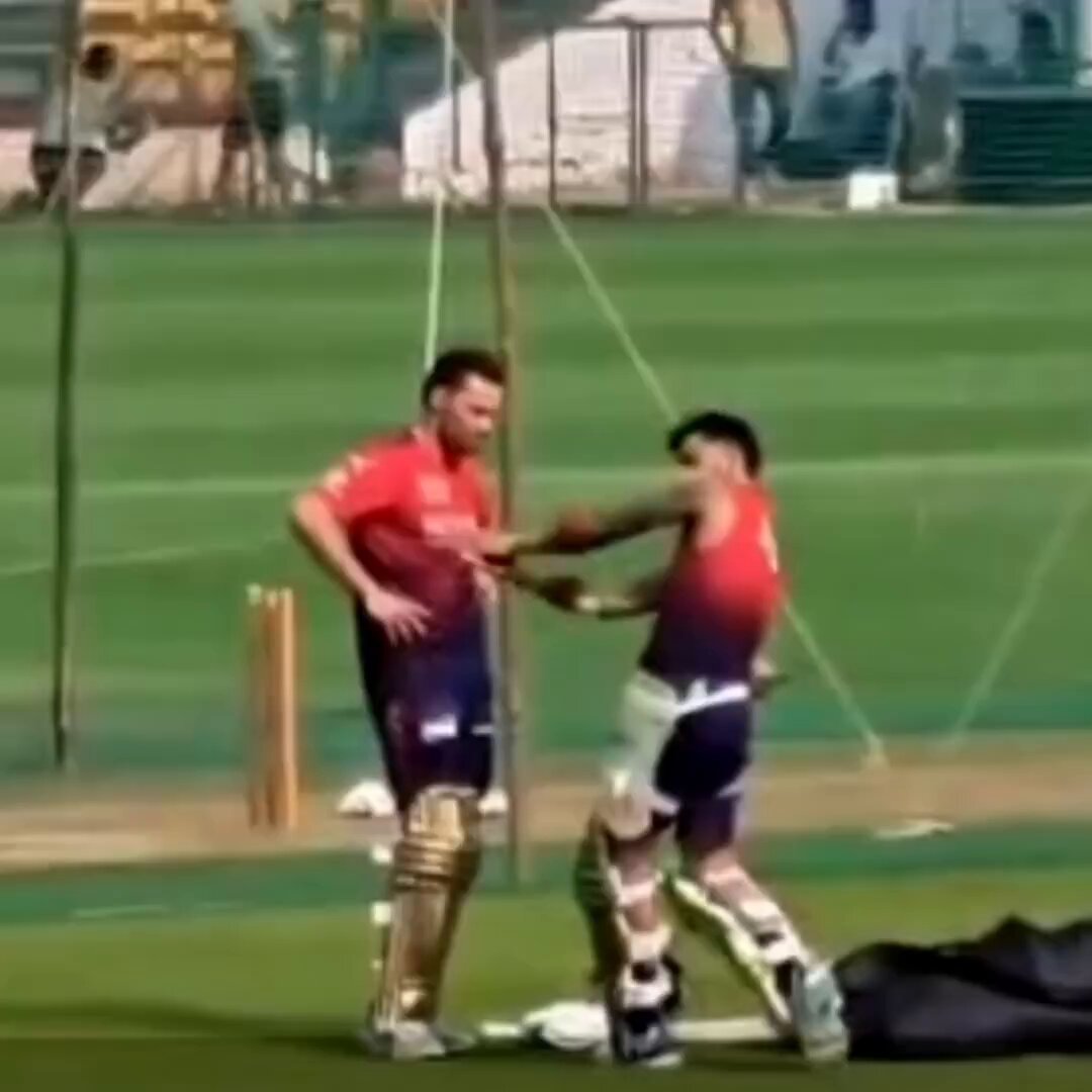 Virat Kohli helping Phil Salt during a practice session at the M. Chinnaswamy Stadium as Salt struggles against short balls. He shares his experience with him and guides him. A true leader, Virat Kohli is always ready to help his teammates.