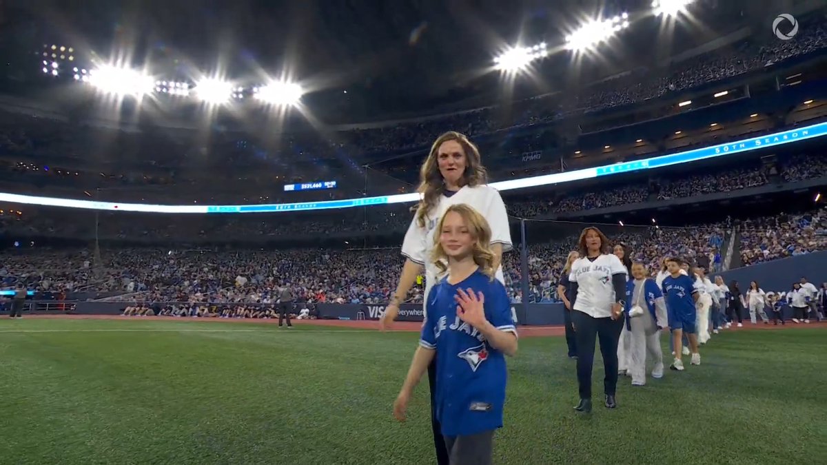 Every team needs a team 💙 Holding the banner to celebrate our American League Champions and 50th Season…our full time staff members with the families of our players!