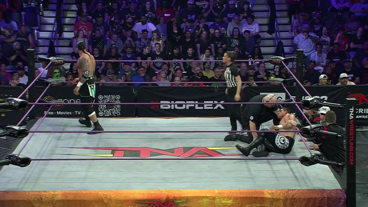 Under chaotic circumstances, Edward Edwards goes crashing through a table at the hands of Mike SANTANA🇵🇷! #TNASacrifice