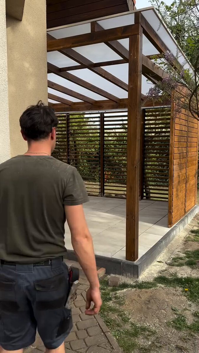 This modern, timber-framed pergola uses integrated sliding louver panels as a versatile solution for controlling privacy, airflow, and light in outdoor living spaces.