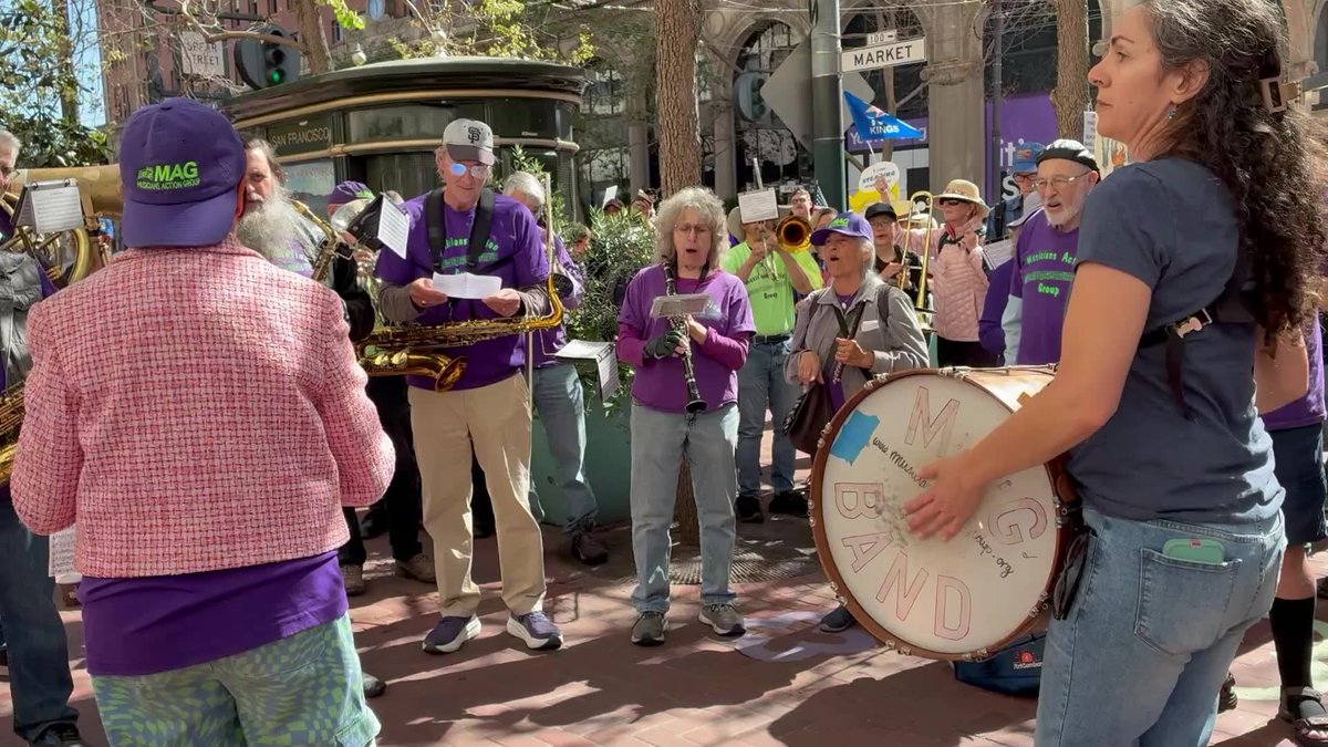 Members of the Musicians Action Group perform “Battle Hymn Republic” outside Hyatt Regency during the third No Kings Day event near Embarcadero Plaza in San Francisco on Saturday. 🎥: Yoshi James / S.F. Chronicle