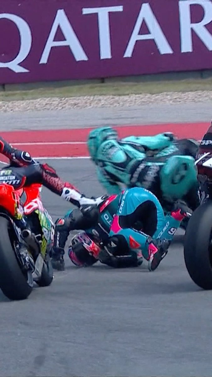 Absolute chaos at the start of #Moto2 😱 How did Holgado walk away from this?! 😮‍💨 #MotoGP | #USGP