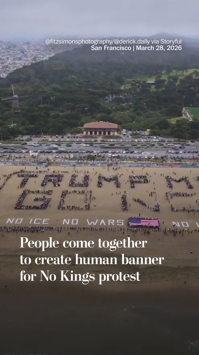 Demonstrators in San Francisco came together at Ocean Beach to form a human sign in protest of the Trump administration on March 28. Read more: