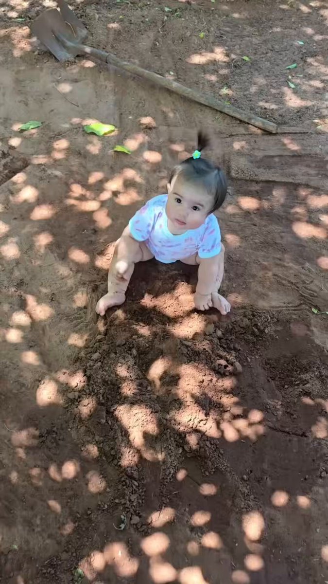 For her eight-month "birthday," her parents took her outside to play in the dirt 😅❤️