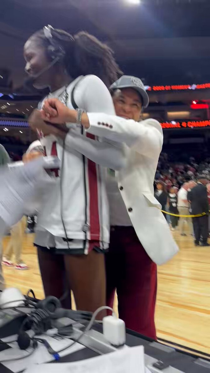 Dawn Staley hugs Agot Makeer after the freshman scored a career-high 18 points off the bench in South Carolina’s 78-52 Elite 8 win over TCU. #marchmadness | #elite8 | #ncaaw