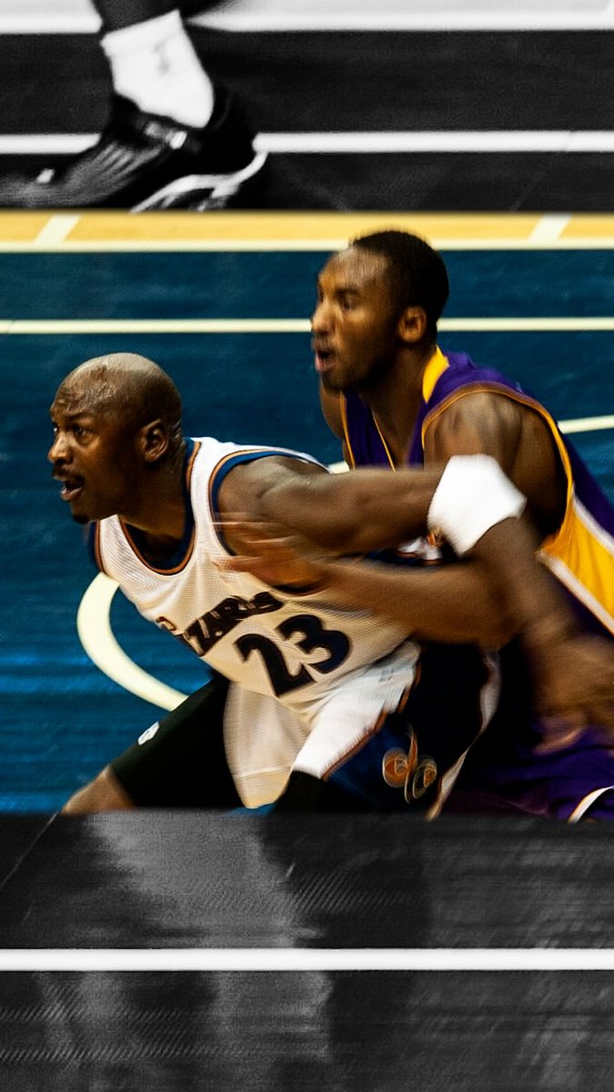Michael Jordan (age 39) makes a gangsta fade-away jump shot over Kobe Bryant (age 23)