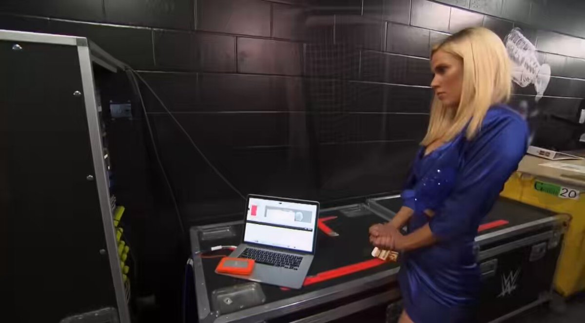 Izzi Dame backstage watching Jaida Parker hit her finisher