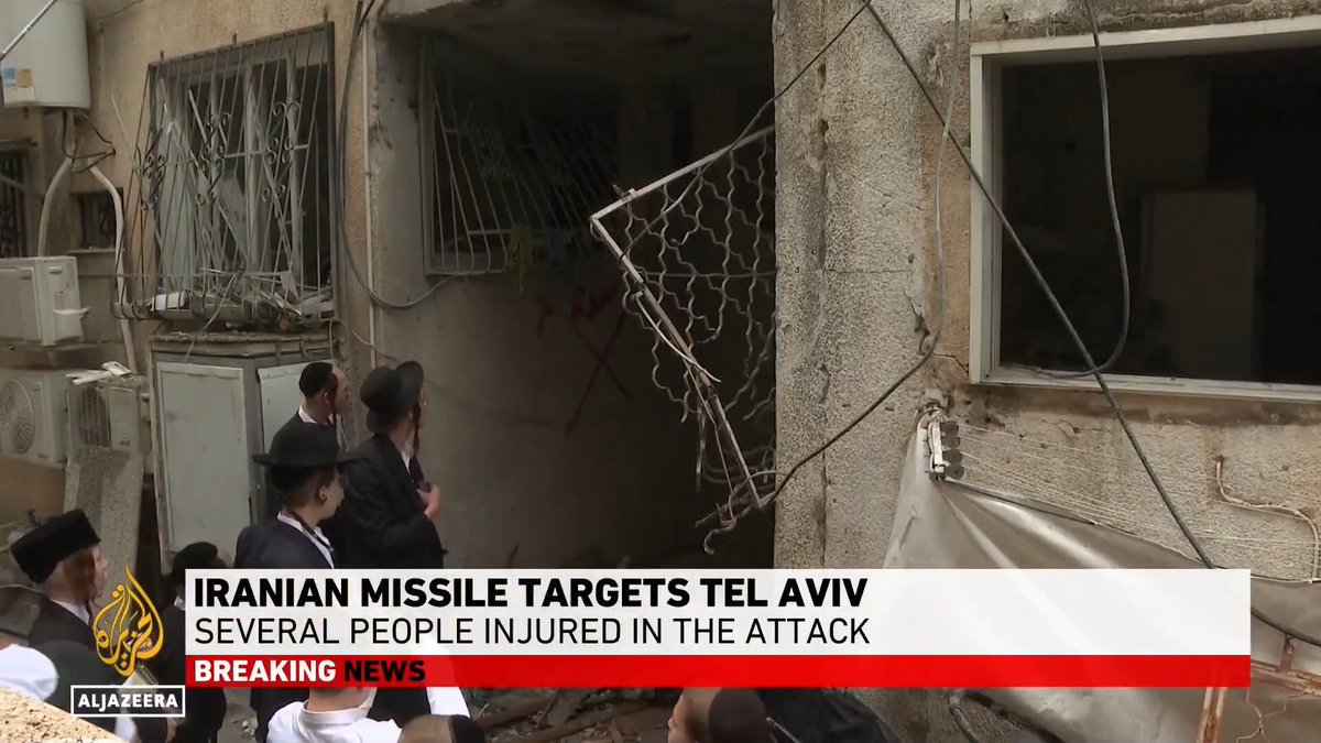 Al Jazeera confirms a massive Iranian ballistic missile strike on Tel Aviv. Israeli emergency services admit cluster munitions bypassed defenses and hit 11 different sites across the capital. The Iron Dome is completely failing to protect the Zionist regime.