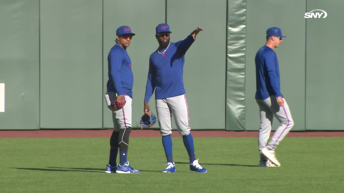 Juan Soto chats in the outfield with Luis Robert Jr.