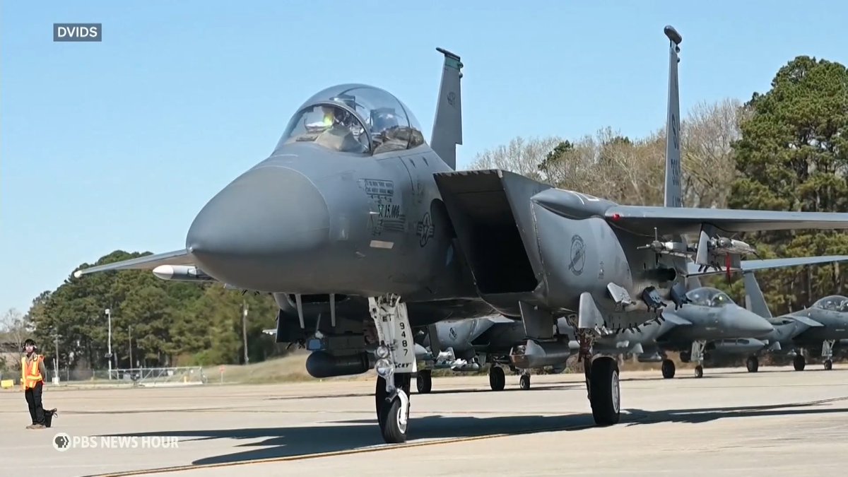 For the first time in five weeks of war with Iran, two American combat aircraft went down in separate incidents. One of two service members onboard an F-15E that was shot down was rescued, but a military official tells the News Hour the whereabouts and status of the second crew member is either unknown or has not been disclosed. During a harrowing rescue mission today, a Black Hawk helicopter was also shot at but was able to return to base. And the pilot of an A-10 Warthog was reportedly rescued after being shot down as it was leaving Iran's air space. Stephanie Sy reports.