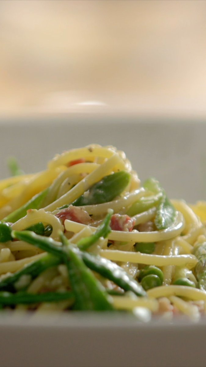 Ina Garten's springtime take on spaghetti carbonara features tons of fresh veggies! 🫛 Get the recipe:
