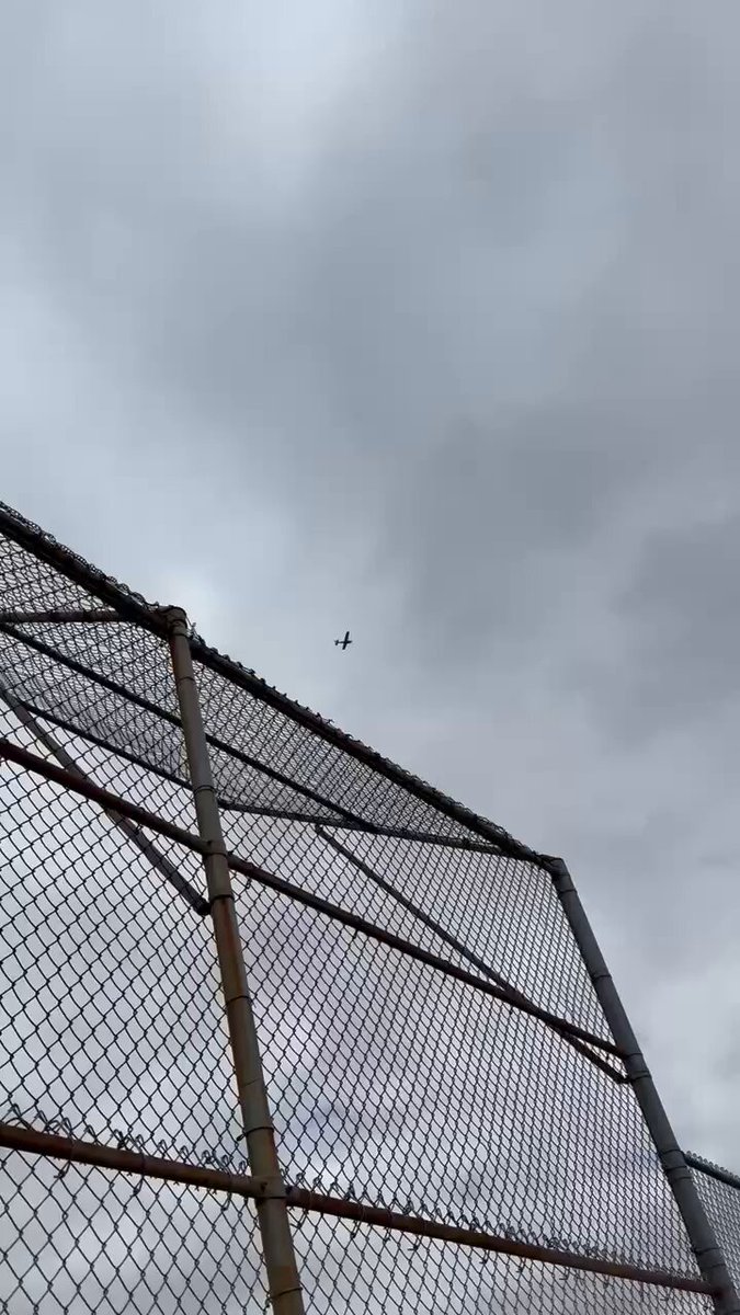 Banner flown over Rhode Island: IRYNA WEEPS SMILEY CREEPS. Referencing the mural controversy.