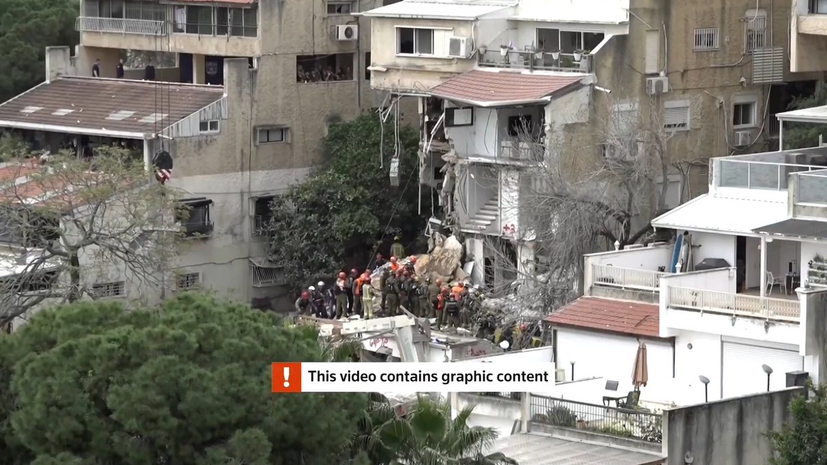 GRAPHIC WARNING: The Israeli military said the bodies of four people were recovered from the rubble of what Israeli media said was an Iranian missile strike that hit a residential building