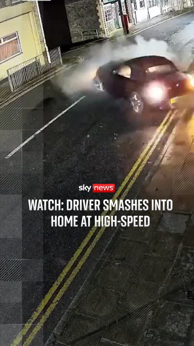 WATCH: CCTV footage shows a driver smash into a house at high-speed. The suspect can be seen leaving the scene by entering a separate vehicle. Local police force in Wales are investigating the incident