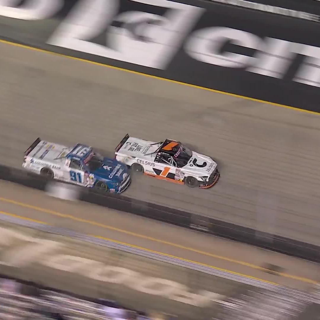 The leaders make contact! Corey Heim hits the wall in Turn 1.