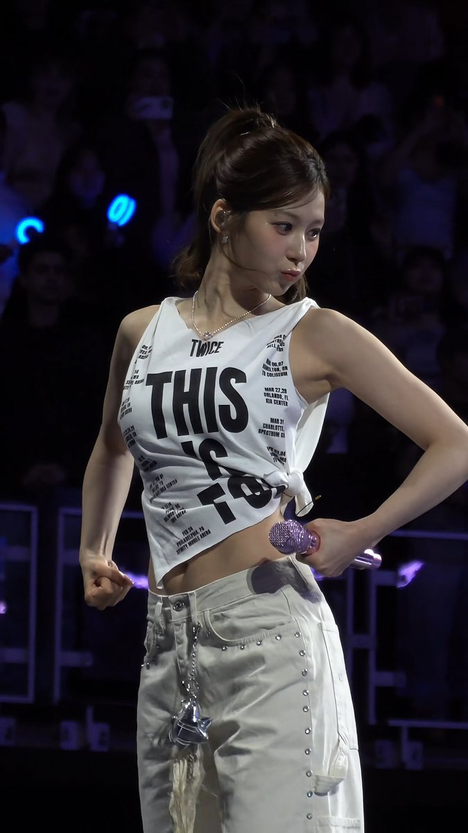 SANA FLEXING IN THE MUSCLE TEE