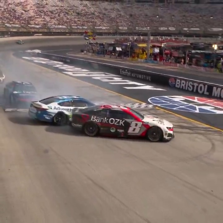 The No. 8 of Kyle Busch goes around after contact with Riley Herbst.