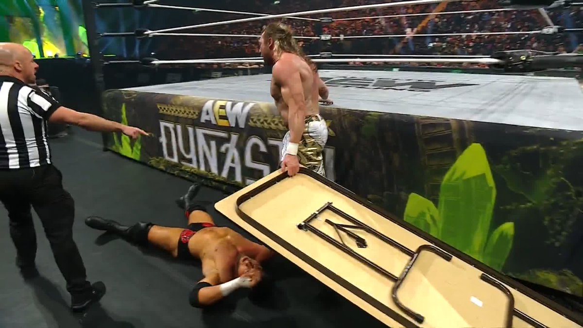 Omega DRIVES the table into Maxwell Jacob Friedman™️ with a diving double stomp! Watch #AEWDynasty LIVE on HBO Max PPV