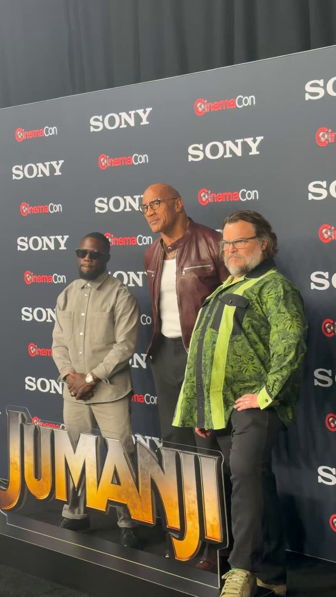 Jack Black ditches his glasses to do The Rock’s signature eyebrow raise ahead of the JUMANJI: OPEN WORLD announcement at CinemaCon