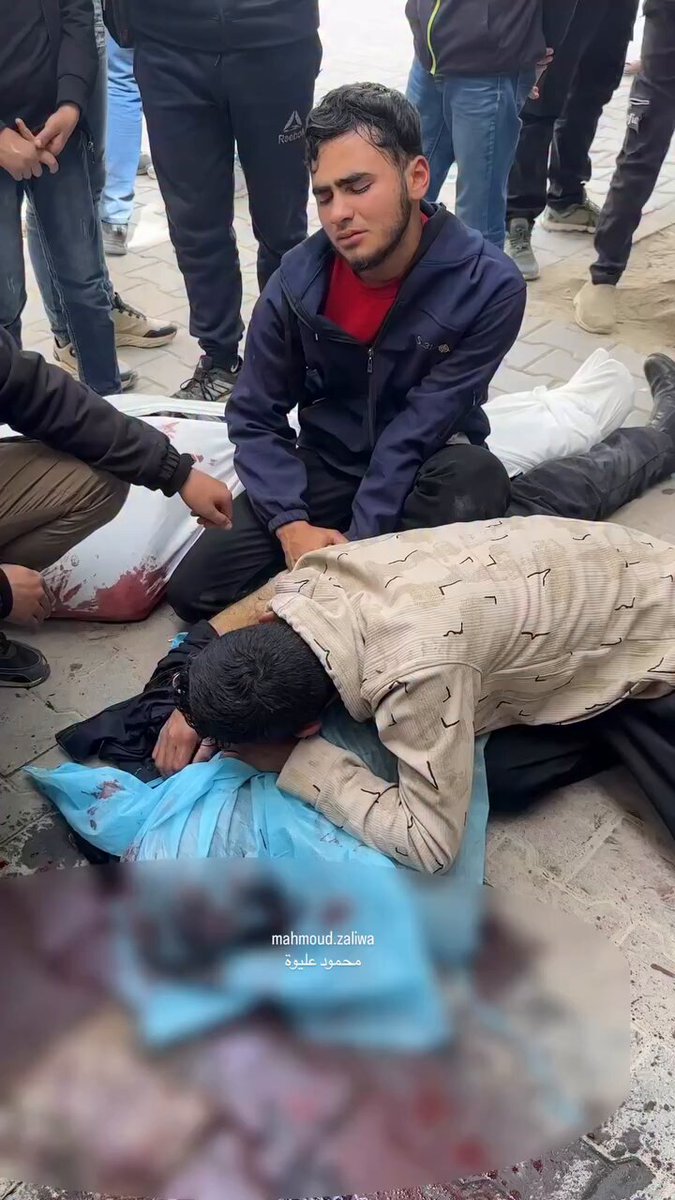 Palestinians mourn their loved ones killed in an Israeli airstrike that targeted a police vehicle earlier in Gaza City, leaving four killed, including a child.