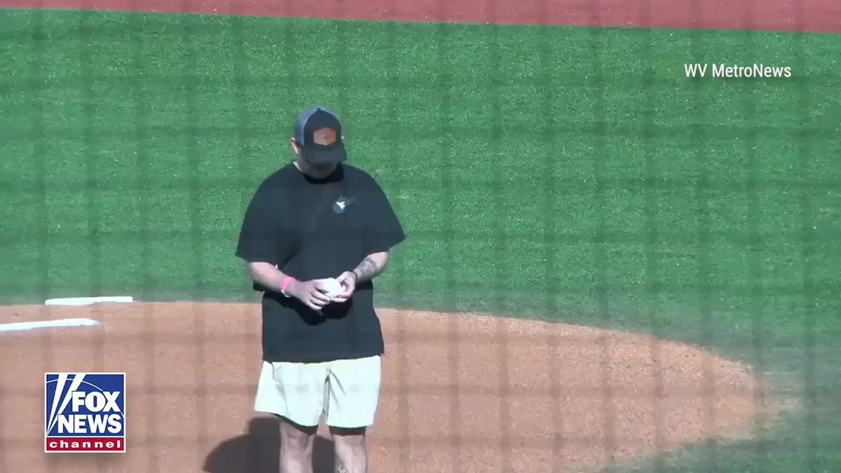 Andrew Wolfe, the National Guardsman wounded in a shooting in Washington, D.C. last year, threw out the ceremonial first pitch before the West Virginia-Penn State baseball game.