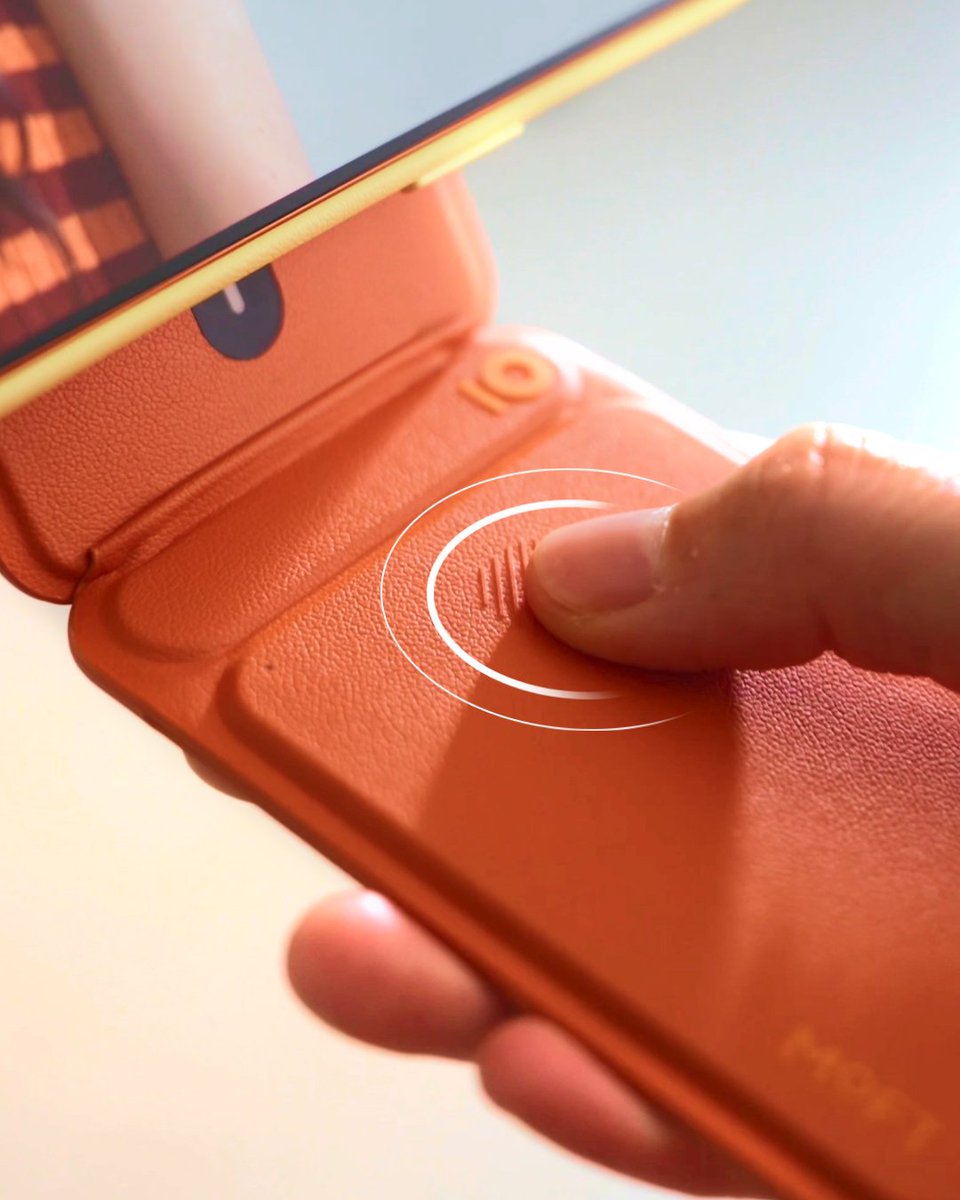 Snap and set. The trackable tripod wallet may look slim, but it does it all. A tripod, a wallet for your essentials, a built-in tracker, and a capture button — all in one, designed to capture every moment effortlessly.