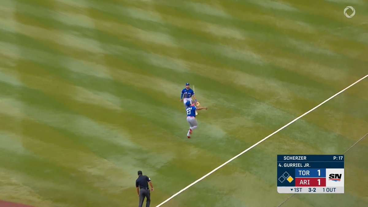 Vladimir Guerrero Jr. runs a LONG way to make this over-the-shoulder grab!
