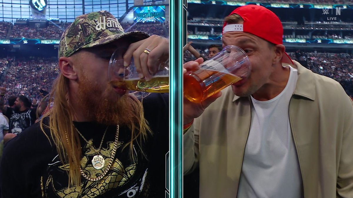 George Kittle and Rob Gronkowski downing beers at Wrestlemania