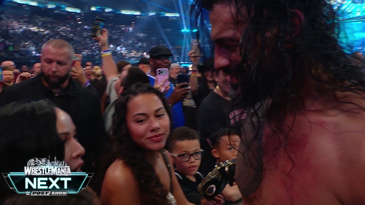 Roman Reigns sharing a moment with his family ringside after becoming the new WWE World Heavyweight Champion ❤️🥹 #WrestleMania
