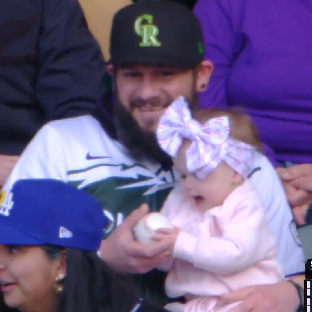 Fan catch of the year?! This guy caught a foul ball while holding a baby 🤯