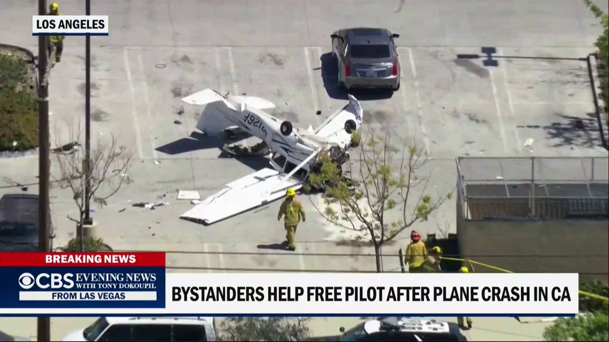 A small plane crashed in the San Fernando Valley north of Los Angeles, flipping upside down in the parking lot of an auto parts store. Bystanders and first responders lifted the aircraft to rescue the pilot.