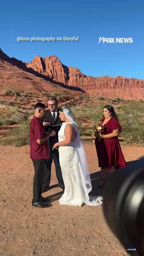 "It's giving me chills!" A wedding in Utah takes a dramatic turn when a rockslide breaks out behind the bride and groom.