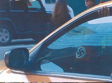 🧑🏿‍🦲 🚕 Black Taxi Driver Wears German Armband