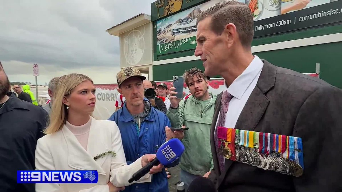 Ben Roberts-Smith has made a defiant appearance on the Gold Coast, joining thousands for the ANZAC Day Dawn Service. Despite facing war crime charges, the Victoria Cross recipient was met with a wave of support from fellow veterans. #9News