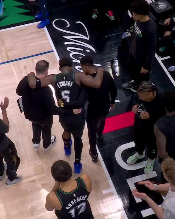 Anthony Edwards was helped to the locker room after an apparent knee injury.