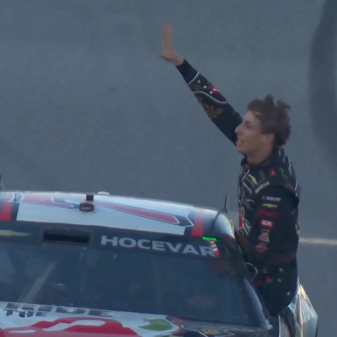 HE IS DRIVING THE CAR AND CELEBRATING WITH THE FANS ... AT THE SAME TIME!!!