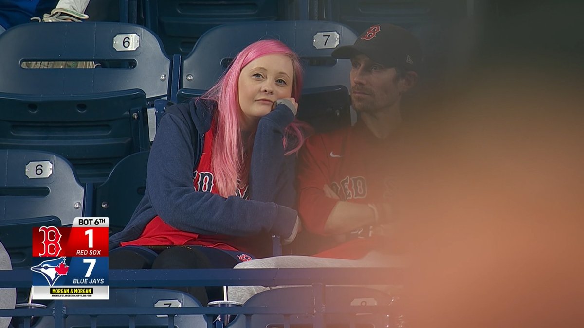 She's doing her best to cheer up her boyfriend while watching the Red Sox. (Via: NESN)