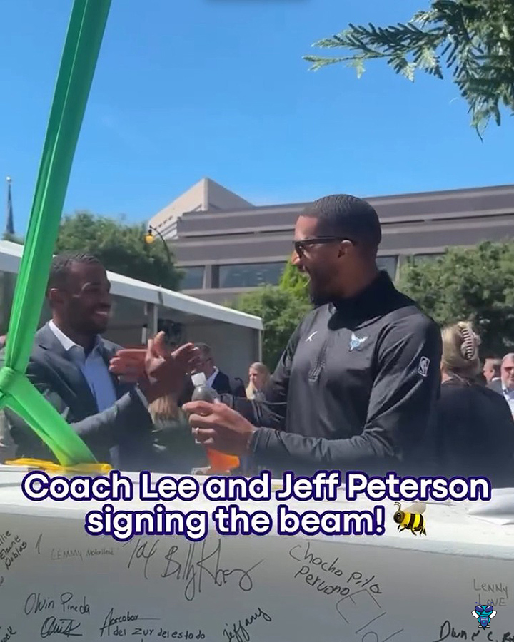Charles Lee and Jeff Peterson signed the topping out beam. ✍️ (📹 Charlotte Hornets)